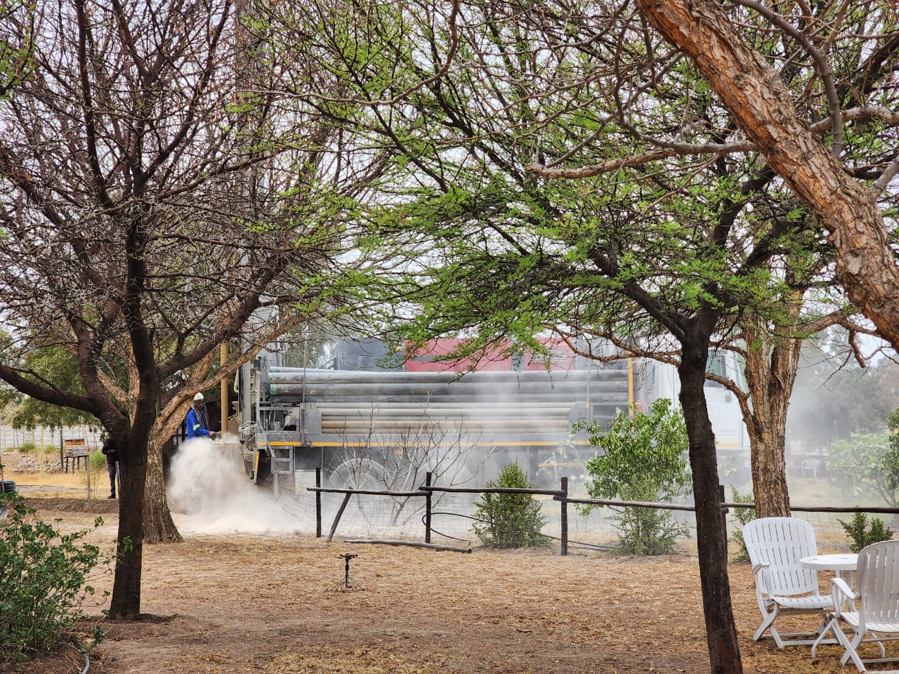 The drilling machine through our vegetable garden
